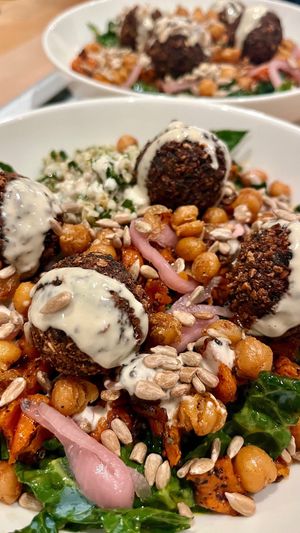 The popular hippie salad (kale with spiced yams, tabbouleh, pickled shallots, crispy chickpeas and toasted sunflower seeds) at Ibiza in Santa Cruz