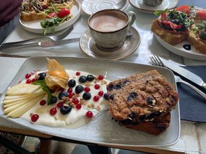 Banana bread and oat cappuccino  at Café Anoa in Ulm