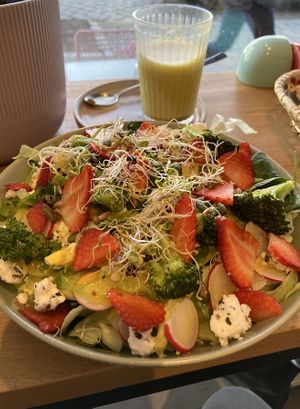 Salad with turmeric latté  at Nest Plant Based Bistro in Berlin