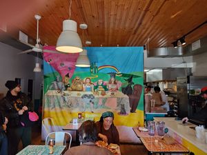 Funky art adorns the dining room and bathroom at Comfortland in Astoria