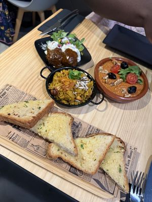 Garlic bread, rice, kofta, muhammara   at MEZZE in Granada