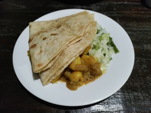 Huge roti with vegetables and potato curry at Indo Restaurant in Noord