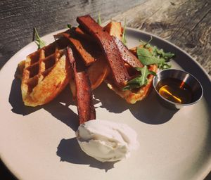 Pao de Queijo Waffles with a side of Seiten Bacon at Essential Vegan Cafe in East London