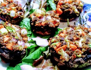 Stuffed Baby Bellas! Mushroom caps stuffed with a savory blend of celery, onion, carrot, seasoned breadcrumbs and more mushrooms! So good! at Sweet Potato Kitchen in Hawi