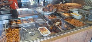 Some of the available meals (visible vegan options are the penne to the left, the imam bayildi in the middle and the tourlu next to it) at Ntoras Mageirefta in Nea Makri