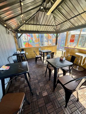 Protected outdoor seating (no seating inside)  at ChuMinh Tofu and Vegan Deli in Seattle