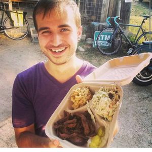 Get your food to go, look as happy and sexy as Thomas is in this picture! at BBQ Revolution in Austin