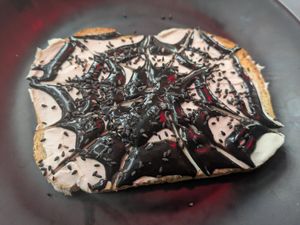 Wednesday (scream cheeze and black sesame tahini swirled like a web on sourdough) at Memento Mori Cafe in Portland