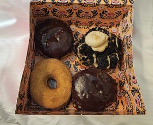 Two Boston creams, a cinnamon sugar, and a brownie cheesecake at Brammibals Donuts - Europlatz in Berlin