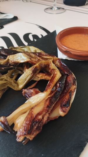 Calçots com a primer del menú at El Racó de la Paella in Torredembarra