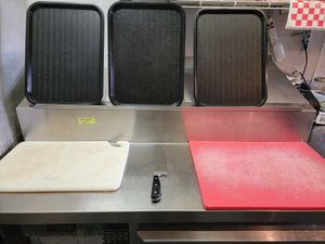 Dedicated food prep area (color coded) for vegan/vegetarian items vs regular items. at Burger Vibe in Houston