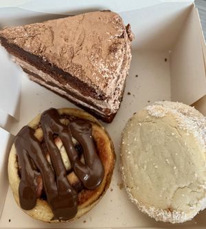 Chocolate Cake, “Nutella” cinnamon bun, something with caramell  at Pastelería Málaga Vegana in Malaga