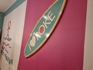 Sign logo on wall at I Love Poke in Rome