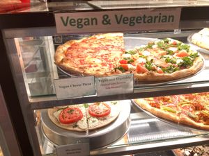Vegan slices prominently displayed at iPizzaNY - Times Square in New York City