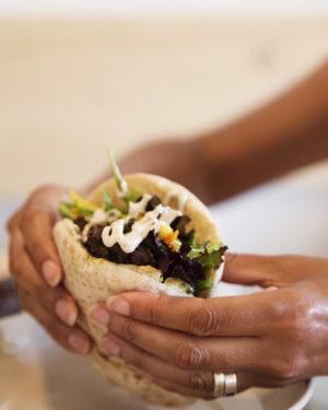 Pita with hummus falafel tahini salad and pickles at The Hummus Kitchen in Aljezur