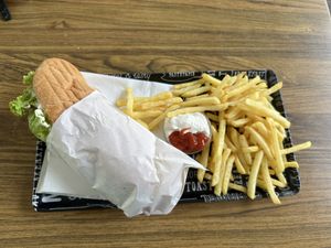 Hot dog with fries  at Loving Hut in Maribor