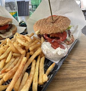 Cheese green burger with fries and dipping sauce  at Loving Hut in Maribor