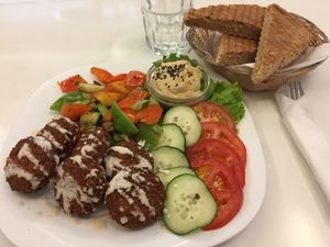 Falafel with vegetables, humus, and bread at Loving Hut in Maribor