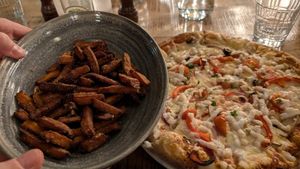Sweet potato fries and vegan pizza at Ósinn Restaurant at Hotel Höfn in Hofn I Hornafirdi