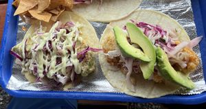 Fried avocado on the left and firecracker cauliflower on the right.   at Totally Taco in Roatan