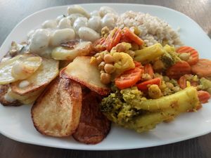 Ñoquis con papas asadas, brocoli y arroz. at 108 in Ljubljana