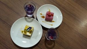 Passion fruit and pomegranate cheesecakes with flower tea. So good I almost cried.  at GreenWoods Raw Cafe in Kowloon