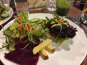 Salad with burger, amazing beetroot patty !!! at GreenWoods Raw Cafe in Kowloon