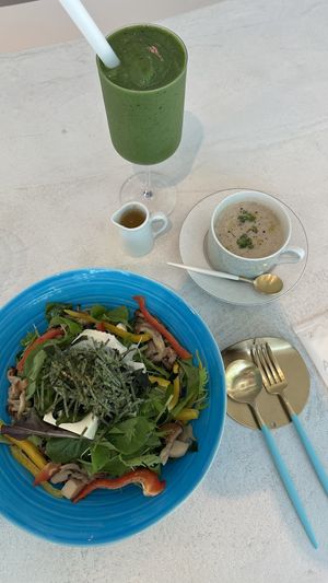 Tofu and wakame salad with pickled mushrooms. Served with a warm soup and dressing on the side. Also got a green smoothie.  at and S organic in Fukuoka