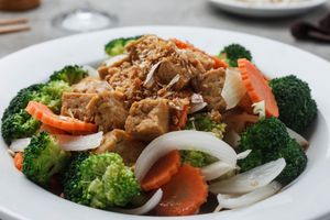 Vegan Thai Fried Rice - Thai jasmine rice, wok-fried with broccoli, Chinese broccoli, cabbage, green onion, onion. Garnished with lime. at Sukho Thai - Marigny in New Orleans