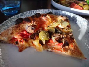 Perfect slice of wood fired Vegan Capri Pizza. at The Italian Sul Lago in Milton Keynes