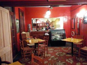 Dining area with serving counter in the back at Bhava in New Orleans