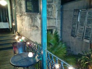 Dining area overlooking a nice courtyard to the side & below at Bhava in New Orleans