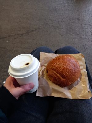 Coconut latte and pain au chocolat at Noch Coffee Co in Dundee