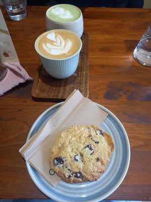 Coconut latte and vegan choc chip cookie at Noch Coffee Co in Dundee