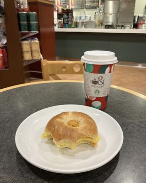 Vegan JUST Egg Bagel Sandwich and a latte with oat milk. at Barnes & Noble Cafe in Bloomington