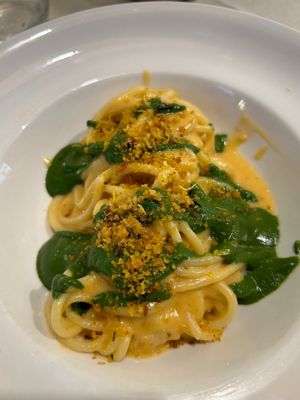 First course: spaghetti with a hummus and sun-dried tomato sauce and spinach sauce, lemon-flavored crumbs at Da Gio in Reggio Calabria