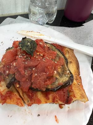 Eggplant slice. Has a little spice!  at Village Square Pizza in New York City