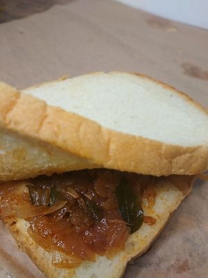 සීනි සම්බෝල පාන් 
🌱 Vegan Seeni Sambol Paan 🌱

Soft bread + caramelized onions = pure bliss! 😋🔥 Our seeni sambol paan is 100% vegan, packed  at Petti Kade in Colombo