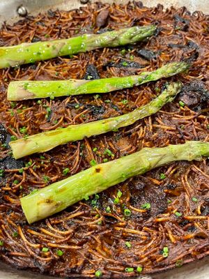 Noodles paella with grilled asparagus and mushrooms at El Petit in Tossa De Mar