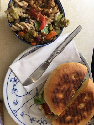 Tempeh Cashewkeese Panini mit kleinem Salat  at Cafe Rotkehlchen - Venloer Str in Cologne