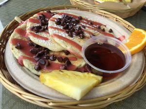 Choc chip strawberry GF pancakes. I’m in heaven  at Evolution Bakery and Cafe in Kailua Kona
