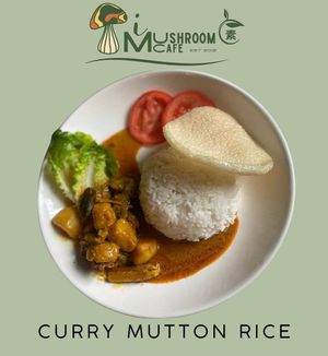 Curry Mutton Rice is a flavorful vegetarian dish made with spiced rice, rich curry sauce, and plant-based mutton substitute. at i Mushroom Cafe in Kota Kinabalu