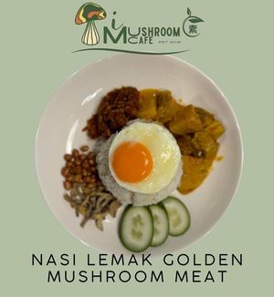 Nasi Lemak with Golden Mushroom Meat is a vegetarian twist on the classic dish, featuring rice, spicy sambal, and golden mushroom "meat." This nasi lemak vegetarian. at i Mushroom Cafe in Kota Kinabalu