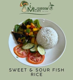 Sweet and Sour Fish Rice is a vegetarian dish with tangy, flavorful sauce and plant-based fish, served over rice. at i Mushroom Cafe in Kota Kinabalu