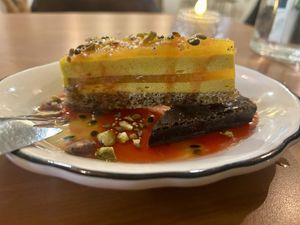 Partially frozen passion fruit dessert + brownie  at Hum Vegan in Montreal