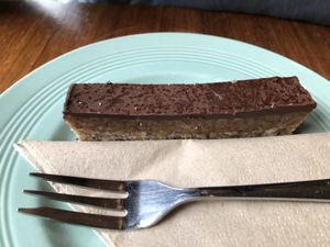 Raw millionaires shortbread - Really great taste! Loved that chocolate sweetness together with the almonds. Sooo yummi! Can recommend that one definitly! at Eden Cafe in Witney