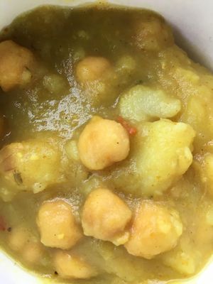 Vegan curry potatoes w chick peas  at Sunrise Caribbean in Washington