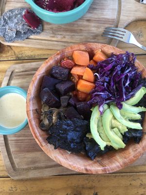Super bowl with rice, quinoa, roasted carrots, beets, sautéed mushrooms, cherry tomatoes, and avocado- served with thai curry sauce. Best Buddha bowl EVER!   at Luna y Sol Atitlán - Co-living & Restaurante Vegetariano in San Pedro La Laguna