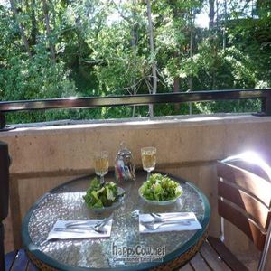 The start to a perfect meal...a glass of local wine and a garden salad while enjoying the sound of the creek! at Greenleaf Restaurant in Ashland