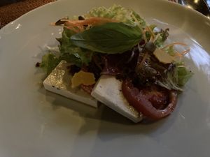 First course: salad with cashew cheese  at Sakti Dining Room in Mambal